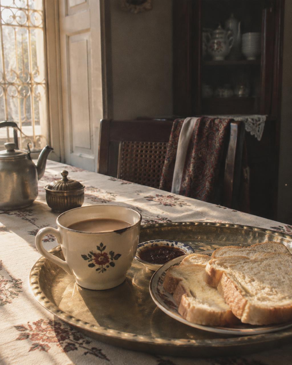 Morning tea and bread arranged on a brass tray